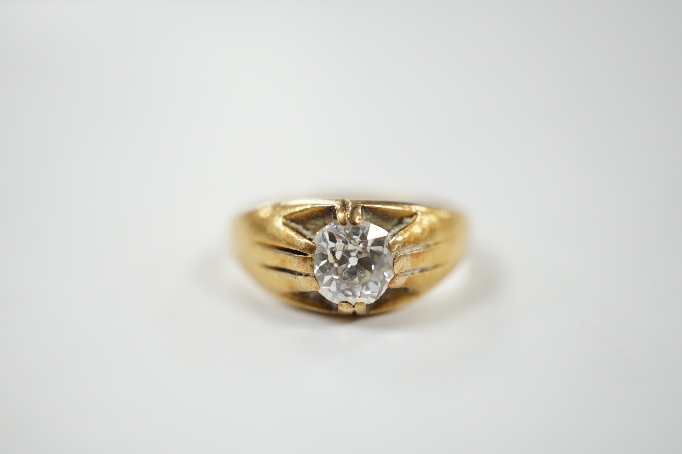 A late Victorian 18ct gold and claw set solitaire diamond ring, size P, gross weight 6.1 grams